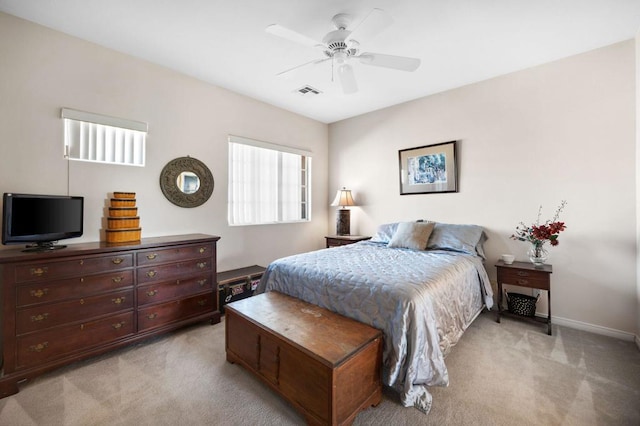 bedroom featuring ceiling fan and light carpet