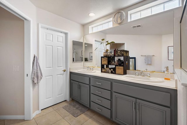 bathroom with tile patterned flooring and vanity