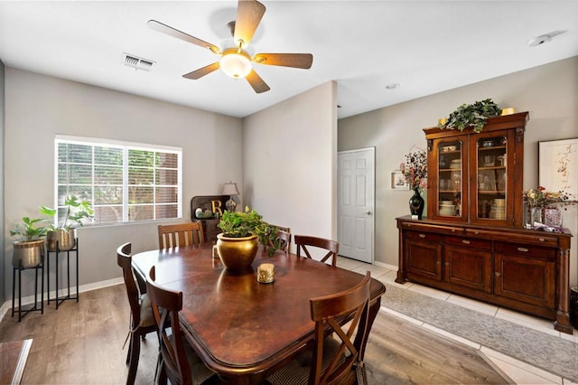 dining room featuring ceiling fan and light wood-type flooring