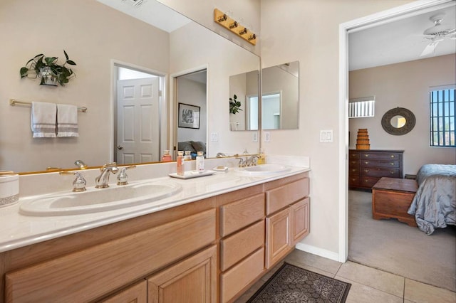 bathroom featuring tile patterned floors, ceiling fan, and vanity