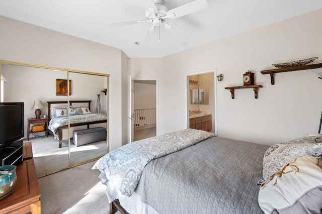 bedroom featuring carpet, ceiling fan, connected bathroom, and a closet