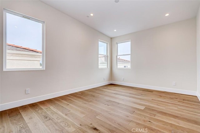 unfurnished room featuring light hardwood / wood-style floors