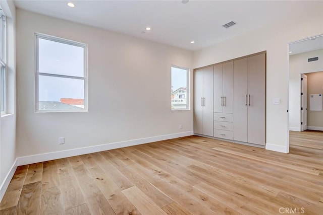 unfurnished bedroom featuring light hardwood / wood-style flooring