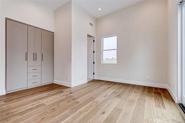 unfurnished bedroom featuring light wood-type flooring