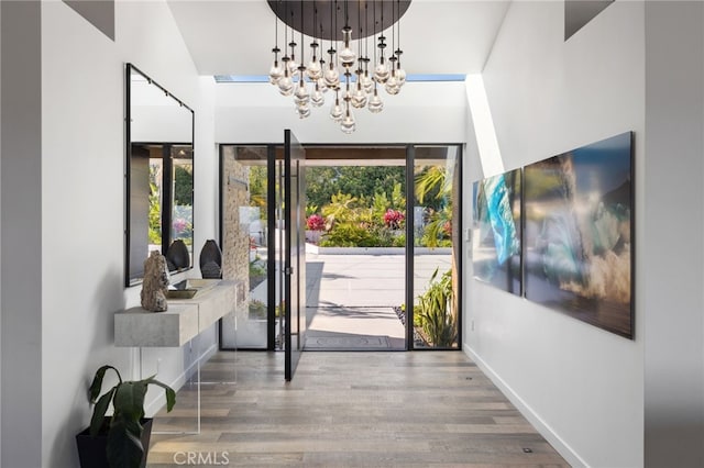44 Sea Cove Dr, Rancho Palos Verdes, CA 90275 - entrance foyer with a chandelier, wood finished floors, and baseboards