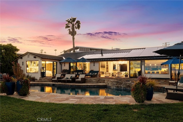 44 Sea Cove Dr, Rancho Palos Verdes, CA 90275 - rear view of property featuring outdoor lounge area, roof mounted solar panels, a patio, and metal roof