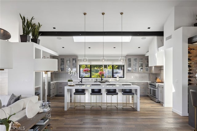 44 Sea Cove Dr, Rancho Palos Verdes, CA 90275 - kitchen featuring stainless steel range, gray cabinetry, light countertops, decorative backsplash, and beam ceiling