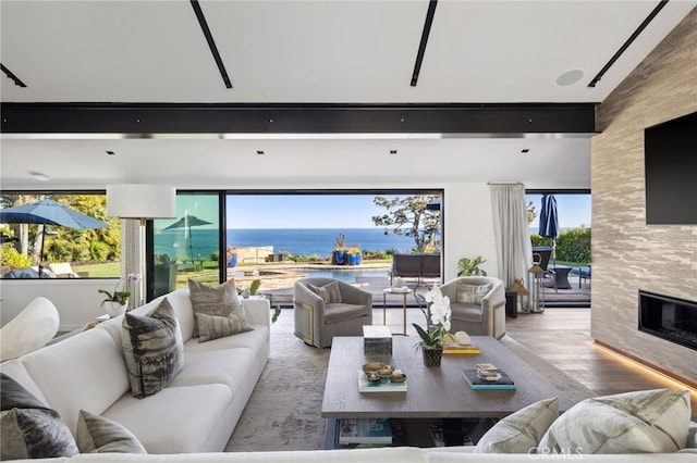 44 Sea Cove Dr, Rancho Palos Verdes, CA 90275 - living area with wood finished floors, a fireplace, and plenty of natural light