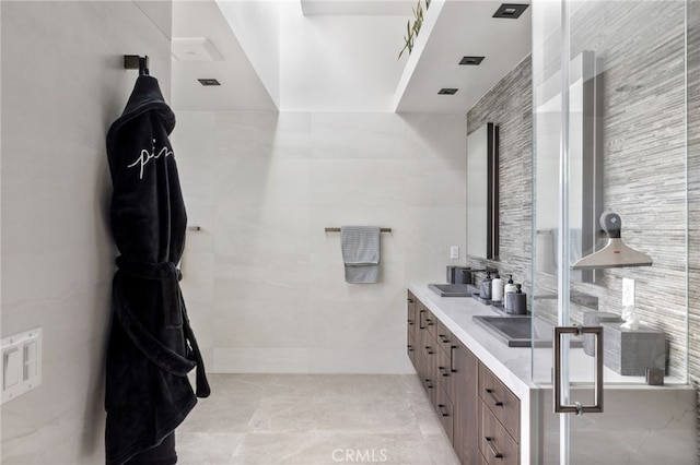 44 Sea Cove Dr, Rancho Palos Verdes, CA 90275 - bathroom featuring tile walls, double vanity, and tile patterned flooring