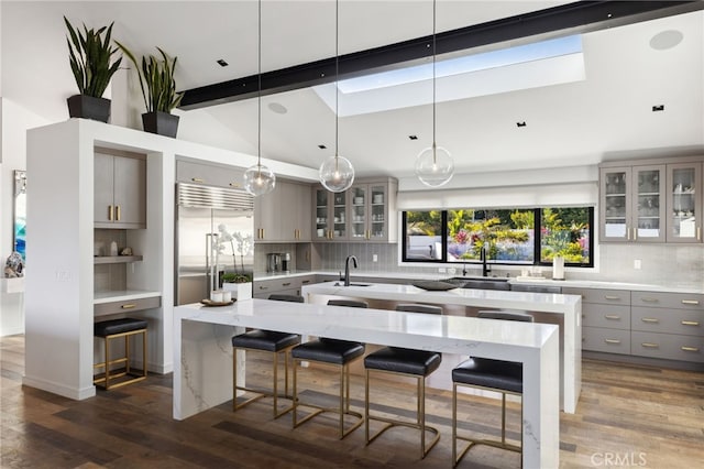 44 Sea Cove Dr, Rancho Palos Verdes, CA 90275 - kitchen with gray cabinets, stainless steel built in refrigerator, a kitchen island with sink, tasteful backsplash, and dark wood-style floors