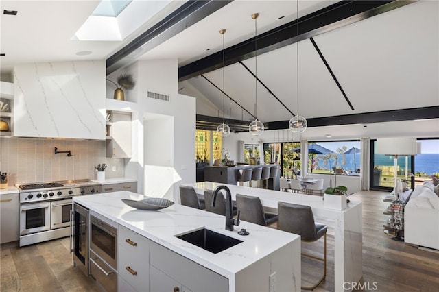 44 Sea Cove Dr, Rancho Palos Verdes, CA 90275 - kitchen with a sink, appliances with stainless steel finishes, dark wood finished floors, backsplash, and open floor plan