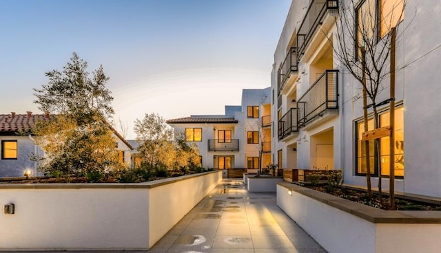 view of patio terrace at dusk