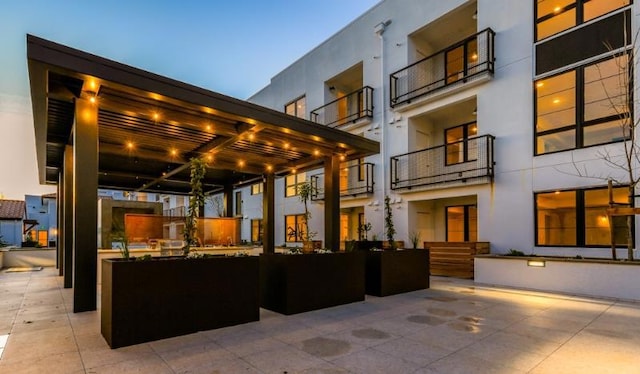 view of patio terrace at dusk