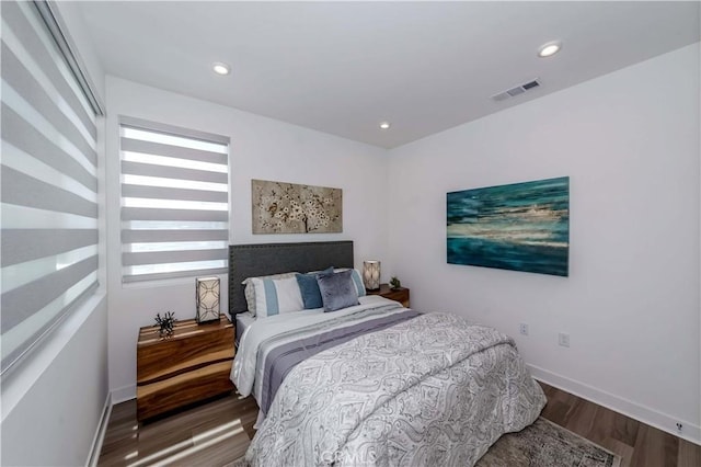 bedroom featuring dark hardwood / wood-style flooring