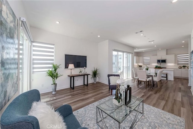 living room with light hardwood / wood-style floors