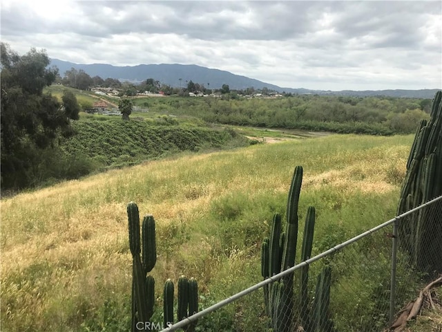 view of mountain feature with a rural view