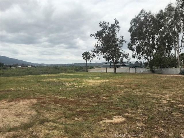 view of yard featuring a mountain view and a rural view