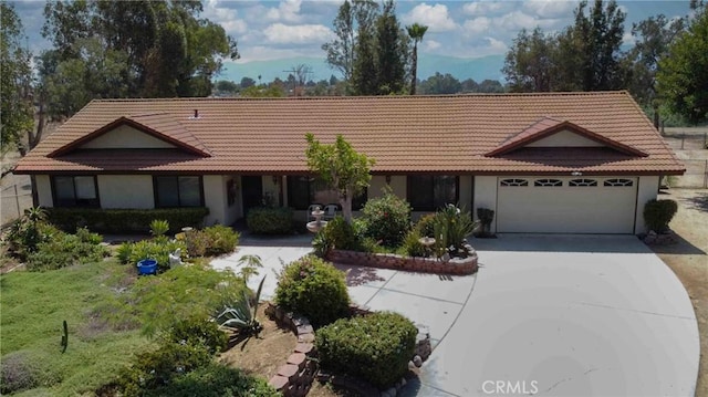 ranch-style home featuring a garage