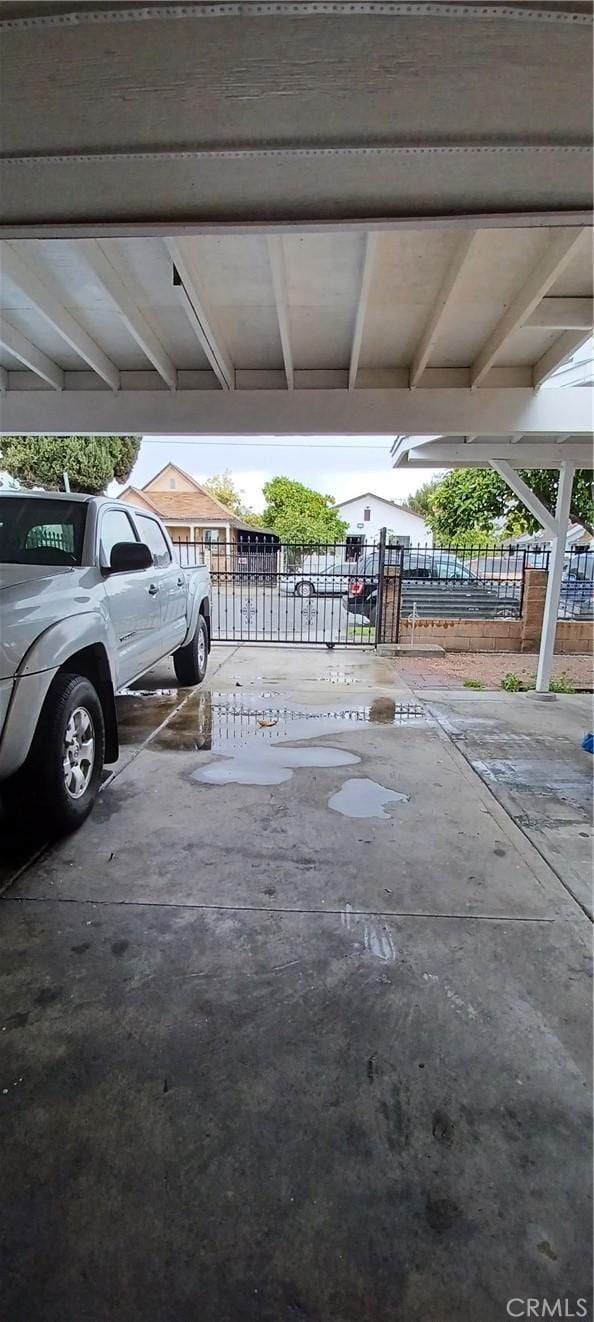 view of vehicle parking with a carport