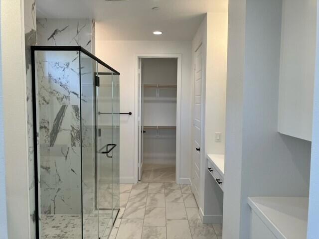 bathroom with vanity and walk in shower