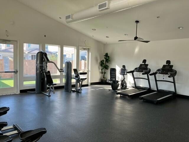 exercise room featuring ceiling fan and lofted ceiling