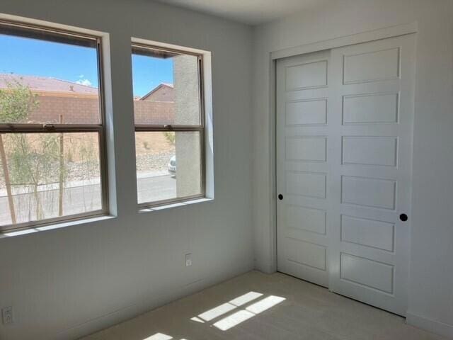 unfurnished bedroom with a closet