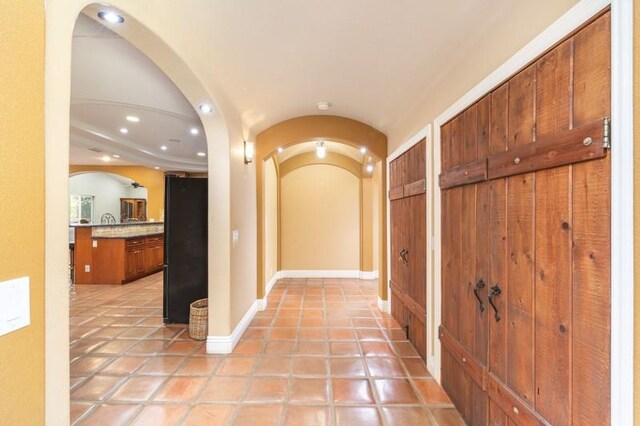 hallway featuring light tile patterned flooring