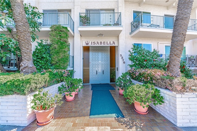 entrance to property with a balcony