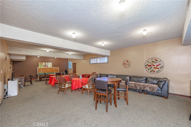 carpeted dining space with a textured ceiling