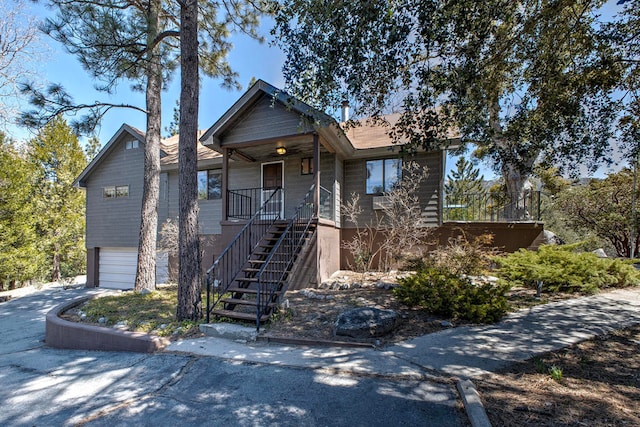 view of front of house featuring a garage and a porch