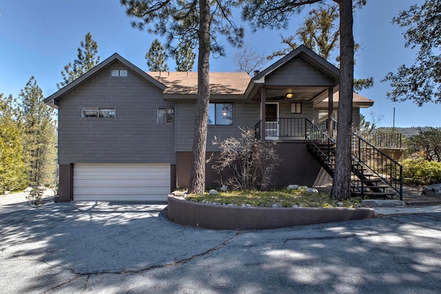 view of front of property with a garage and a porch