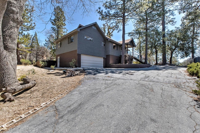 view of side of home with a garage