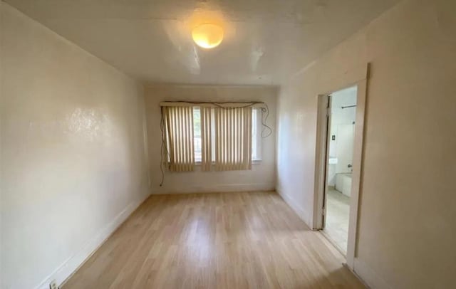 unfurnished room with light hardwood / wood-style flooring