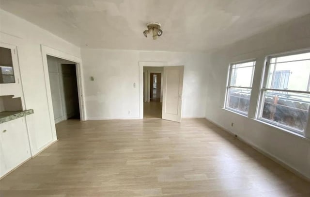 spare room featuring light hardwood / wood-style floors