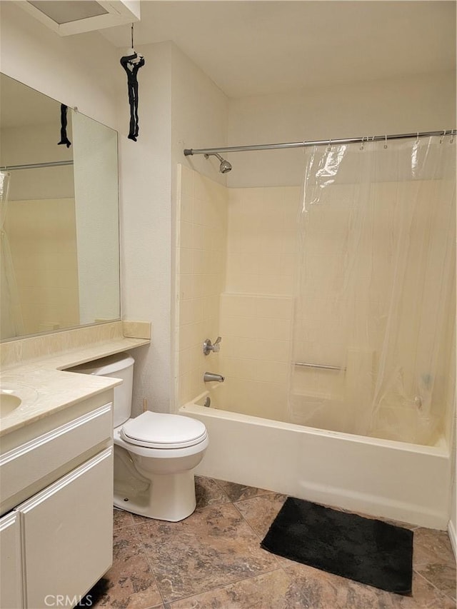 full bathroom with vanity, shower / bath combo, and toilet