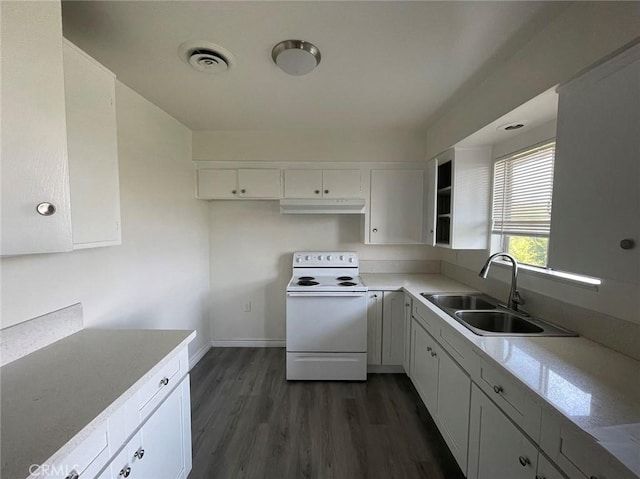 kitchen with white electric range, sink, and white cabinetry