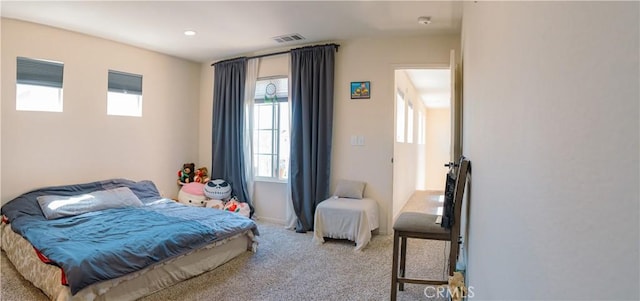 bedroom featuring light colored carpet