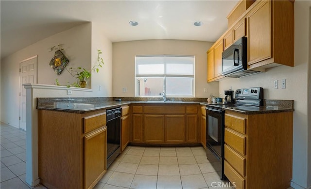 kitchen with light tile patterned flooring, sink, kitchen peninsula, and black appliances