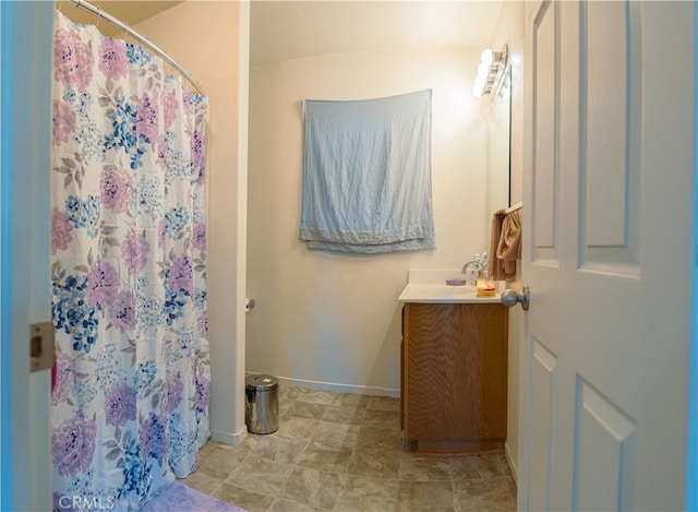 bathroom with vanity and a shower with curtain