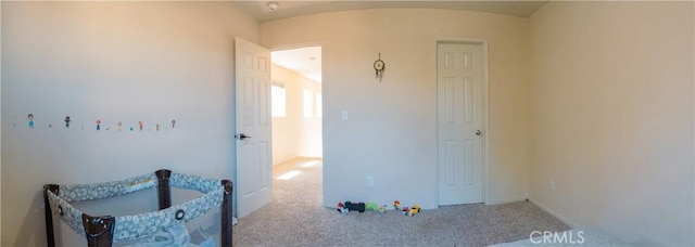 bedroom with light colored carpet