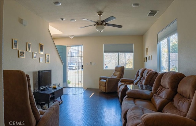 living room featuring ceiling fan and wood-type flooring