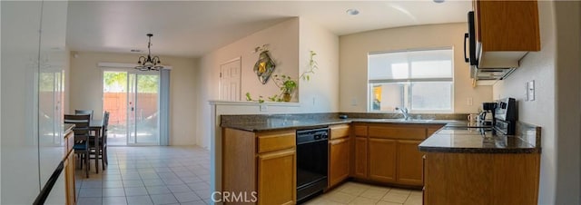 kitchen with kitchen peninsula, black dishwasher, light tile patterned flooring, hanging light fixtures, and sink