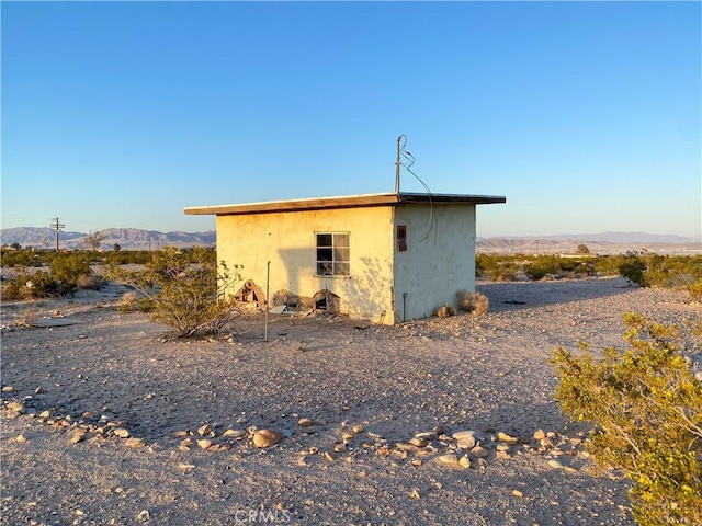 view of outdoor structure featuring a mountain view