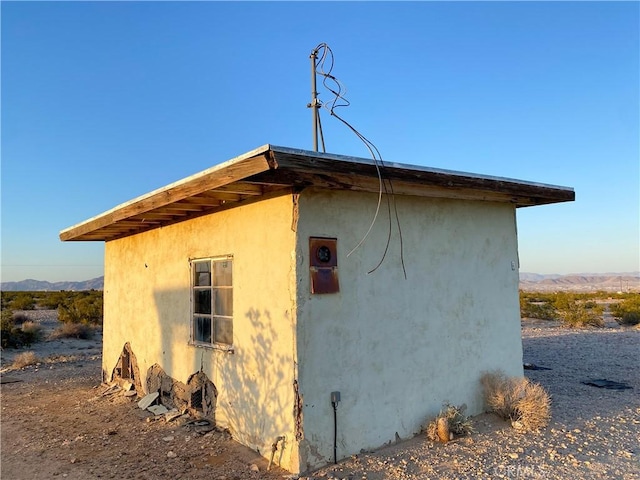 view of home's exterior with a mountain view