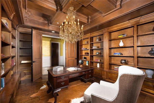 office area with dark hardwood / wood-style floors, built in features, ornamental molding, and an inviting chandelier