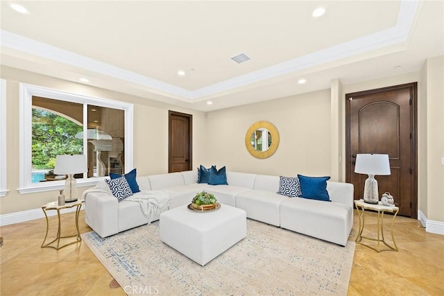 living room featuring a tray ceiling