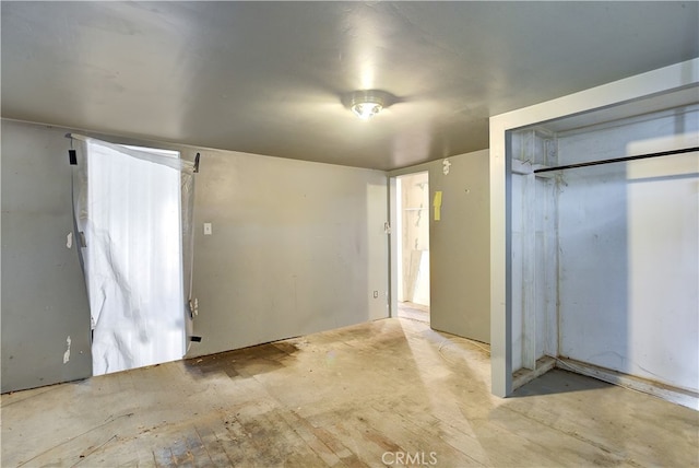 unfurnished bedroom with a closet