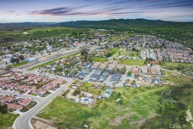 aerial view at dusk with a mountain view