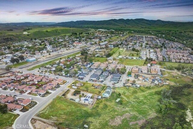 birds eye view of property featuring a mountain view and a residential view