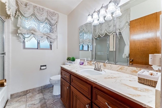 bathroom with a shower with door, toilet, and vanity